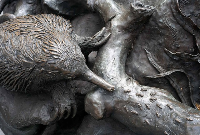Sculpture of an echidna is attached to a larger part of a bronze fountain