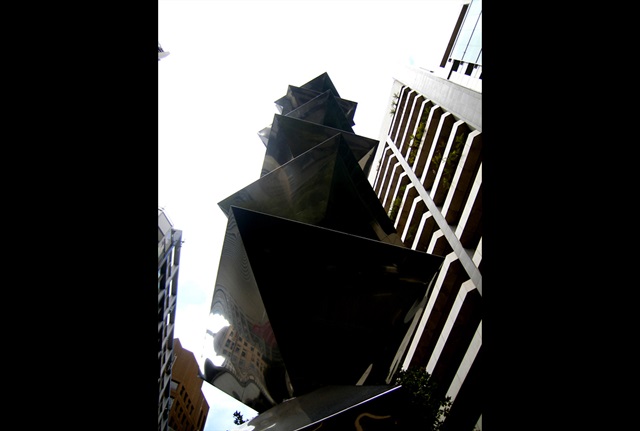 Pyramid shape pieces create a 20 metres high stainless steel tower structure pointing to the sky