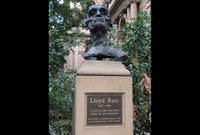 A life-sized bronze bust of Lloyd Rees mounted on a sandstone pedestal with plaque