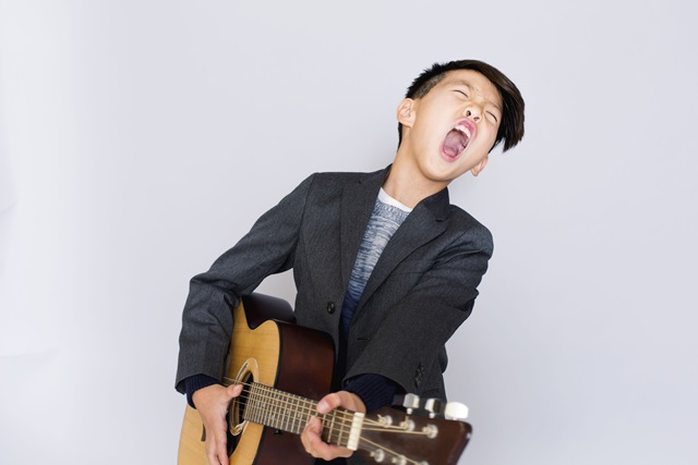Child playing guitar