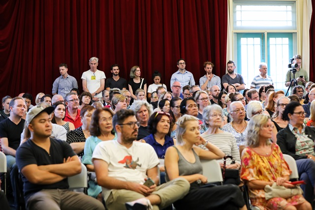 A large group of people for a public meeting at Alexandria Town Hall