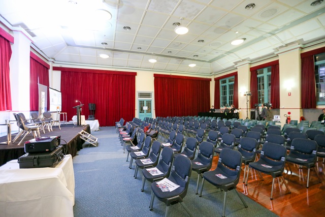 A room within Alexandria Town Hall set up with chairs in front of a stage.