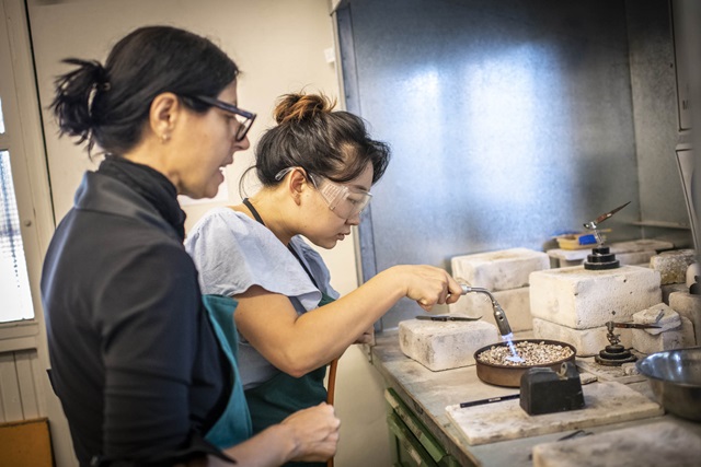 Two women working in a jewellery studio
