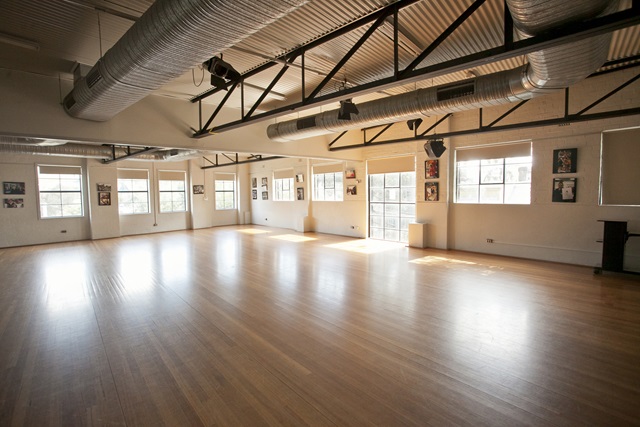 A big hall with wooden floors.