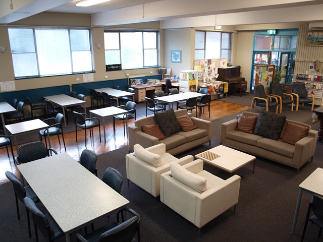 A room with tables and chairs.