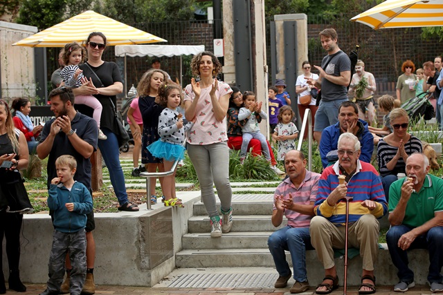 People clapping and enjoying gelato and coffee