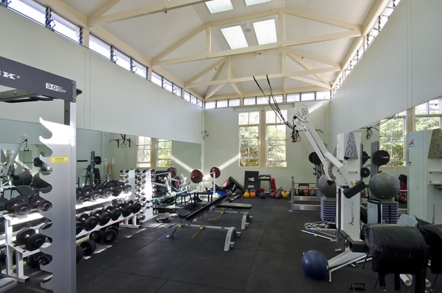 A large gym with exercise equipment.