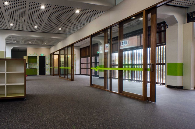 Large open indoor space with glass divider walls.