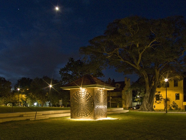 A small building illuminated at night