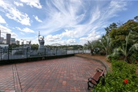 A paved area of the park and seat