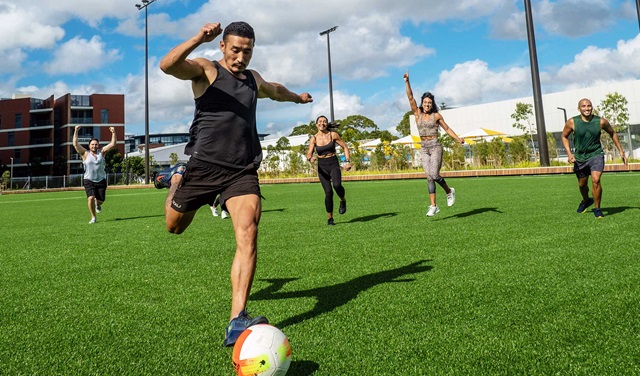 A group enjoys a game of soccer
