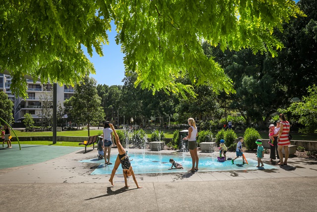 The water play area of Mary O'Brien Reserve surrounded by people.
