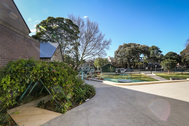 Pathway to the side of community centre leading to Nita McCrae Park