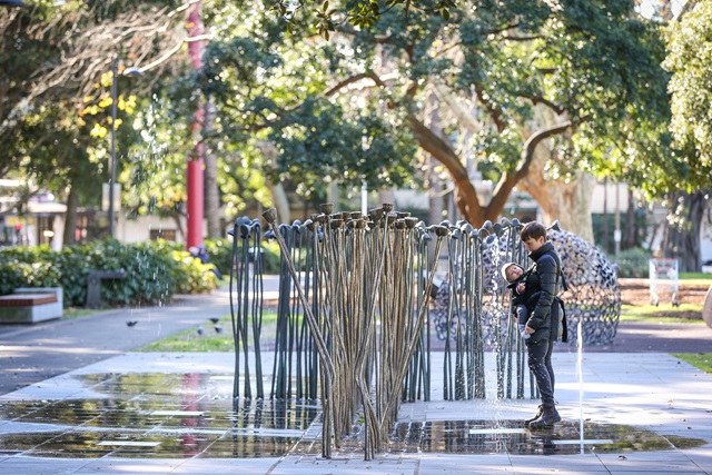 Parent and child at water feature