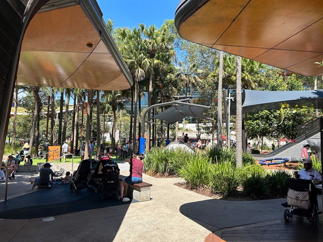 A group of people walking in a park.