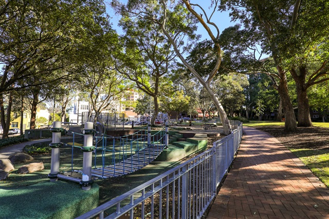 Play equipment includes a suspension bridge. 