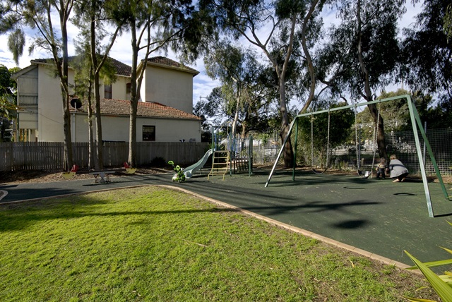Children's play equipment including climbing structure and swing set