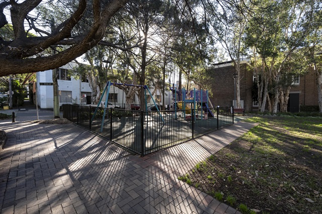 View of fenced play area at Peace Park Playground
