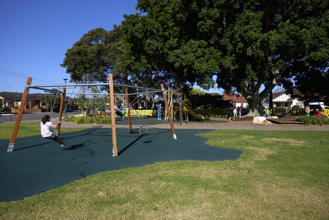 Children playing in playground area in Turruwul Park Playground.