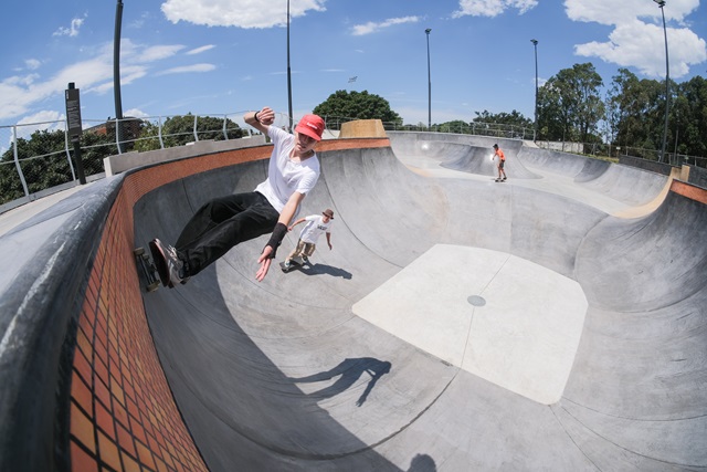 A skater using the public flow bowl at Sydney skate park.