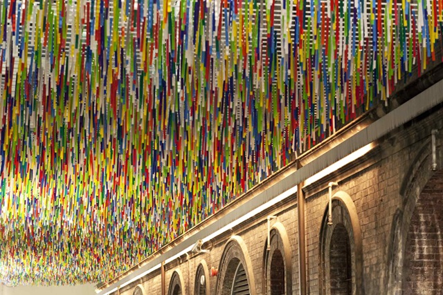 Colourful artwork hanging from a ceiling