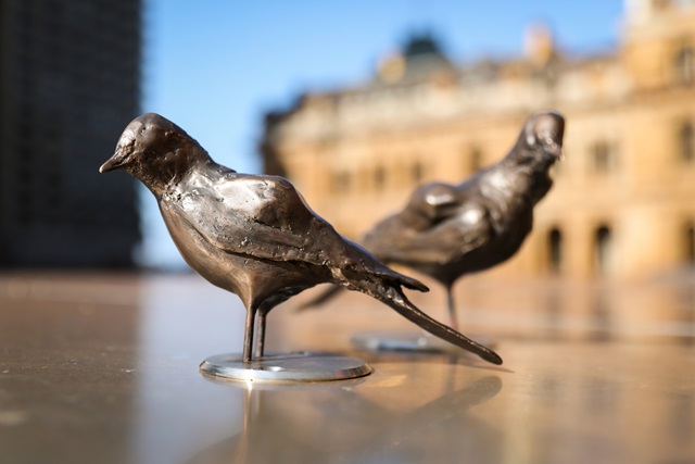 Public artwork of 2 bronze bird sculptures.