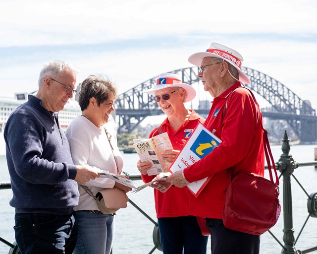 Two Sydney ambassadors chatting to 2 members of the public at Circular Quay.