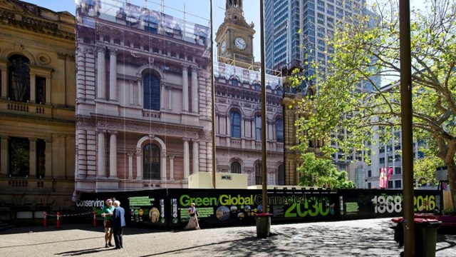 Sydney Town Hall with a surround of hoarding while restoration works are in progress.