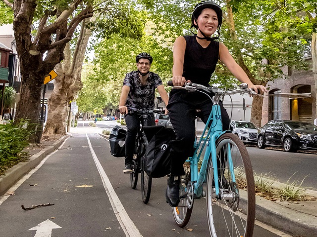  Cyclist riding through a cycleway path