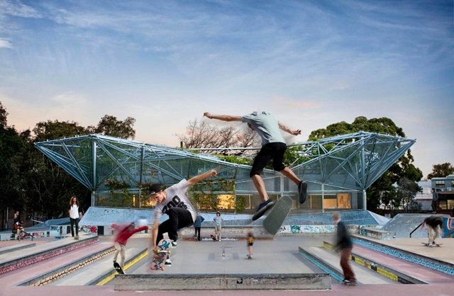 Skateboarders doing tricks in the skate park in Waterloo