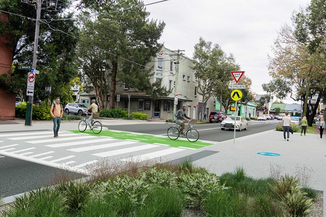 A photomontage of the proposed shared crossing showing two people on bikes and one person walking across Fountain Street.