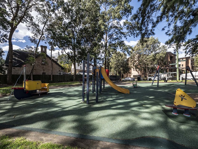 Small park with a swing and a slide