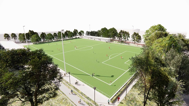Artist’s impression shows soccer players on the field, which is surrounded by trees and people walking along footpaths around it.
