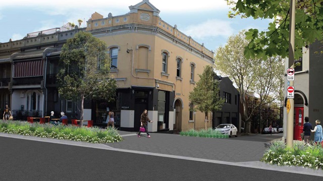 The view shows enhanced street growth with overhead powerlines removed and more greening with plants and shrubs as part of the continuous footpath treatment.