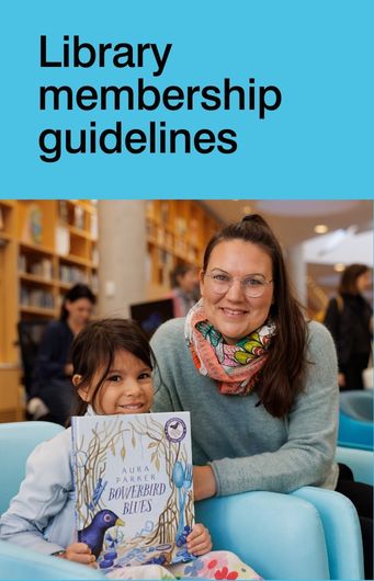 An adult and a child sit together in a library, with the child holding a picture book titled "Bowerbird Blues." Text above reads "Library membership guidelines.