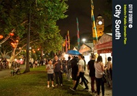 Document cover with a night time market scene in a park with food stalls and trees.