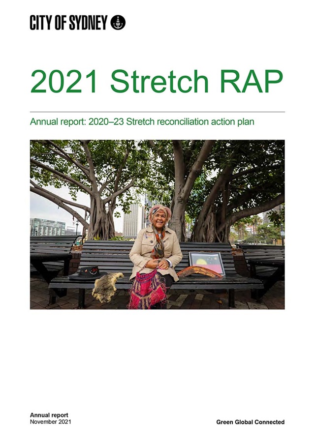 Document cover with photograph of woman in a city park under a fig tree.