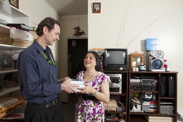 Man and woman holding books