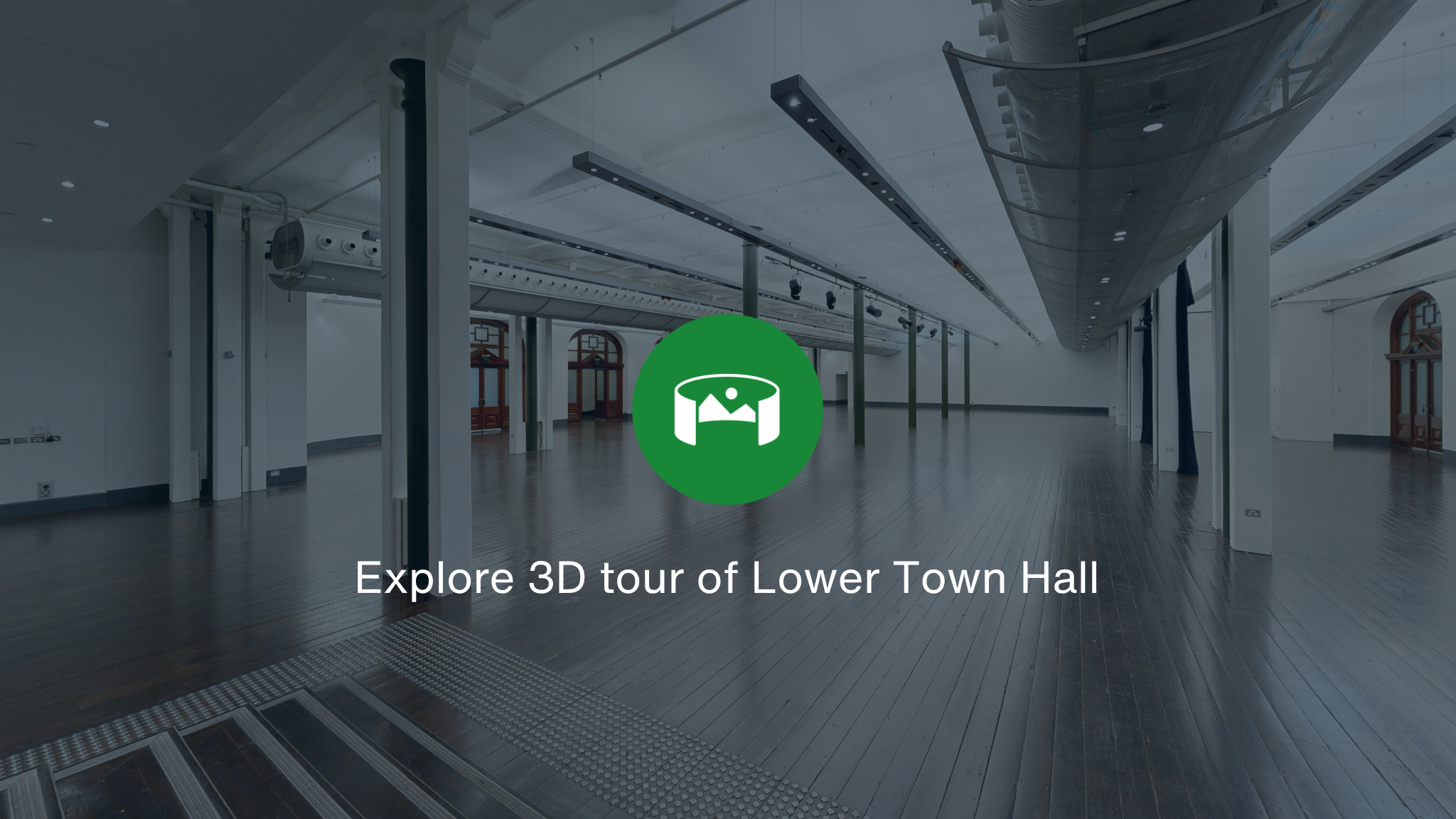 A room overlayed with a green icon and the words Explore 3D tour of Lower Town Hall and Vault.