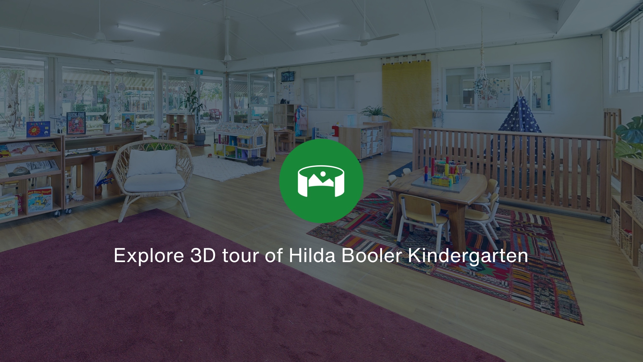 Inside the playroom at Hilda Booler Kindergaten overlayed with a green icon and the words Explore 3D tour of Hilda Booler Kindergarten.